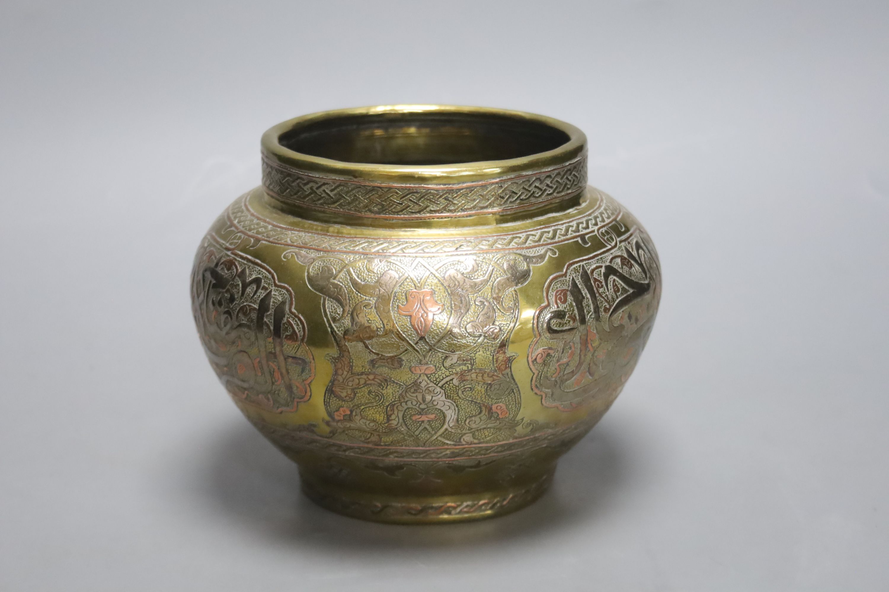 A Cairo ware brass multi-metal inlaid jardiniere, height 13cm